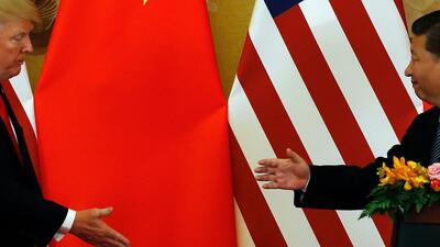 China US Xi vs Trump. Foto: AP Photo/Andy Wong